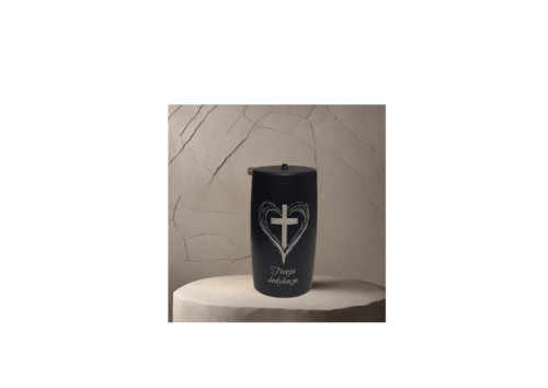 a black container with a cross and heart and dediction on it