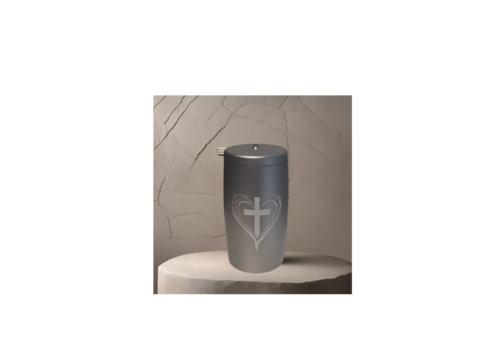 a silver container with a cross and heart on it